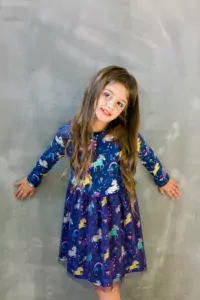 Small girl child model in beautiful dress. Childhood, look, happiness, hairstyle. Kid fashion